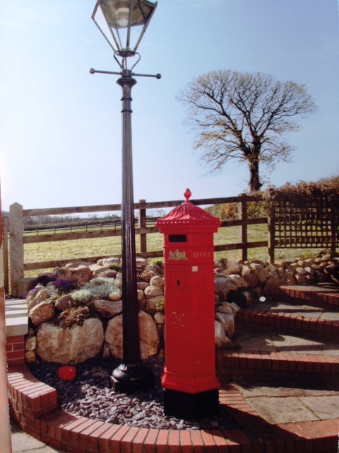 Royal Mail Penfold Pillar Box in UKAA customers garden