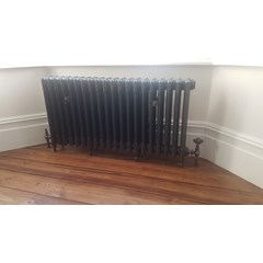 Victorian Style Cast Iron Radiator In A Bay Window 