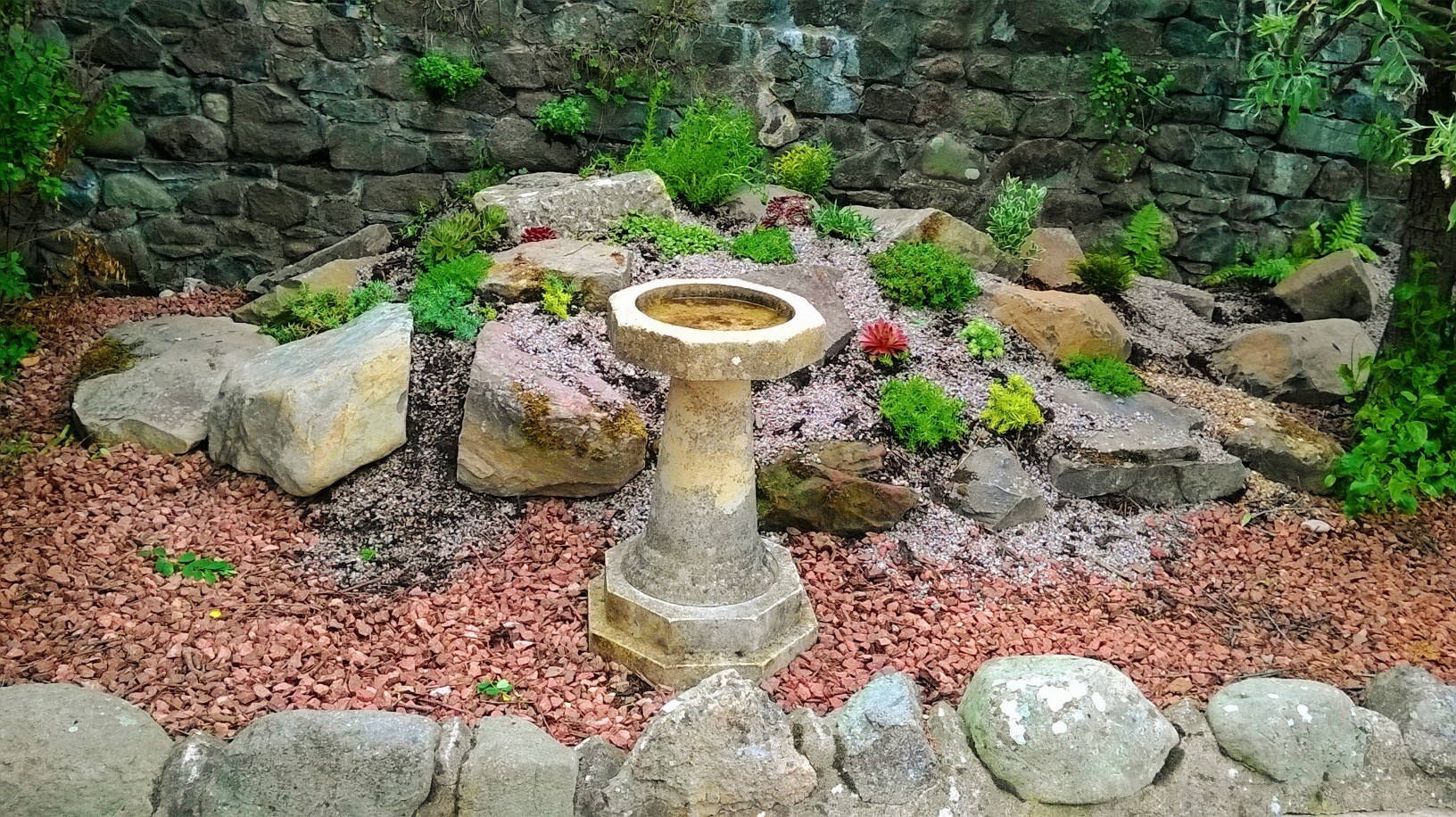Antique stone bird bath in a happy customers garden. Genuine reclaimed stone bird baths are ideal to you in traditional period gardens