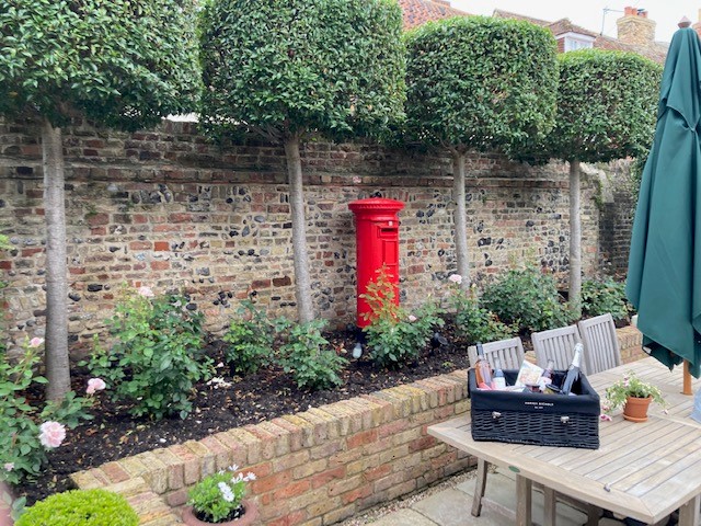 Showing TheAntique Pillar Box Installed in a Customers Garden