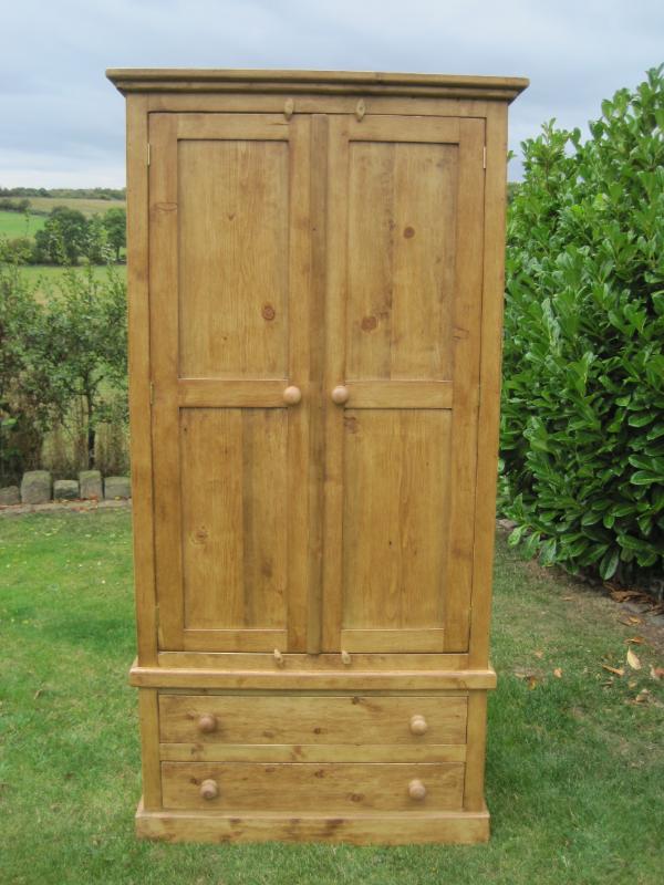 bespoke made wardrobes with built in drawers made from reclaimed pine by our skilled joiners in Staffordshire