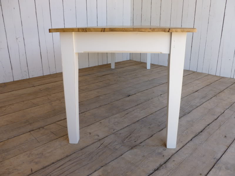 Side view of chamfered edge victorian floorboard table