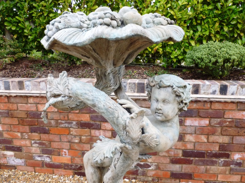 large zinc and bronze reclaimed garden water fountain with an natural stone base ideal for large gardens and patios