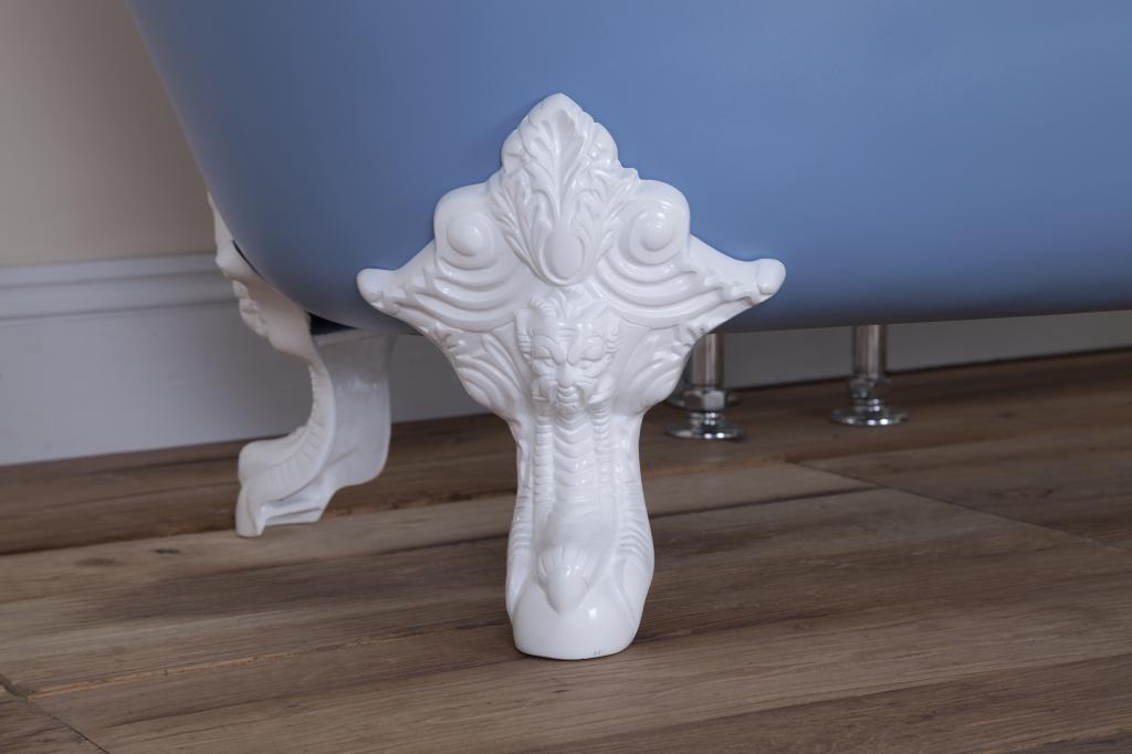 Traditional cast iron ball and claw feet on a new cast iron enamel roll top bath with a painted exterior and a white enamel interior, Victorian style roll top. 