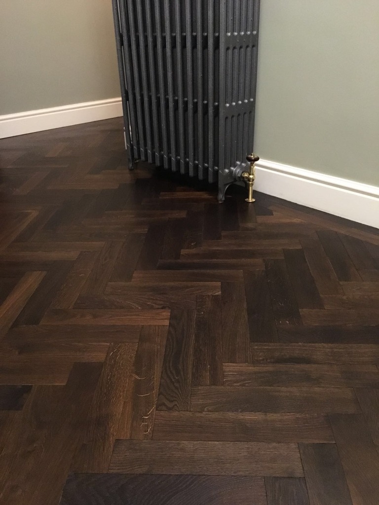 Original antique old recycled parquet flooring fitted in a herringbone design