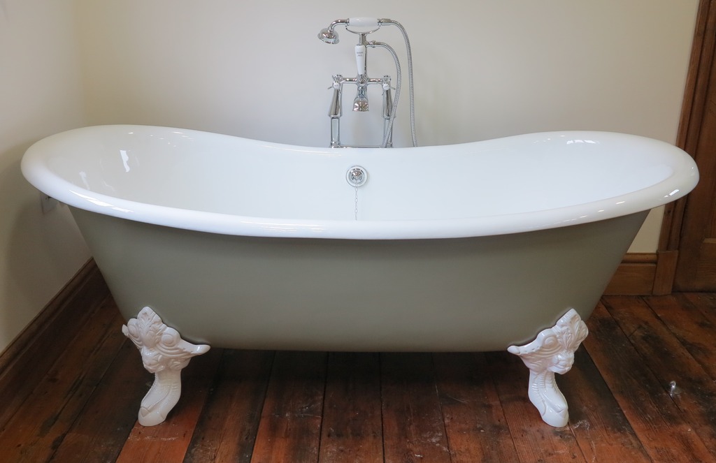 Reclaimed new cast iron high slipper enamel free standing bath tub with claw feet and legs ideal for a period bathroom, painted metal exterior